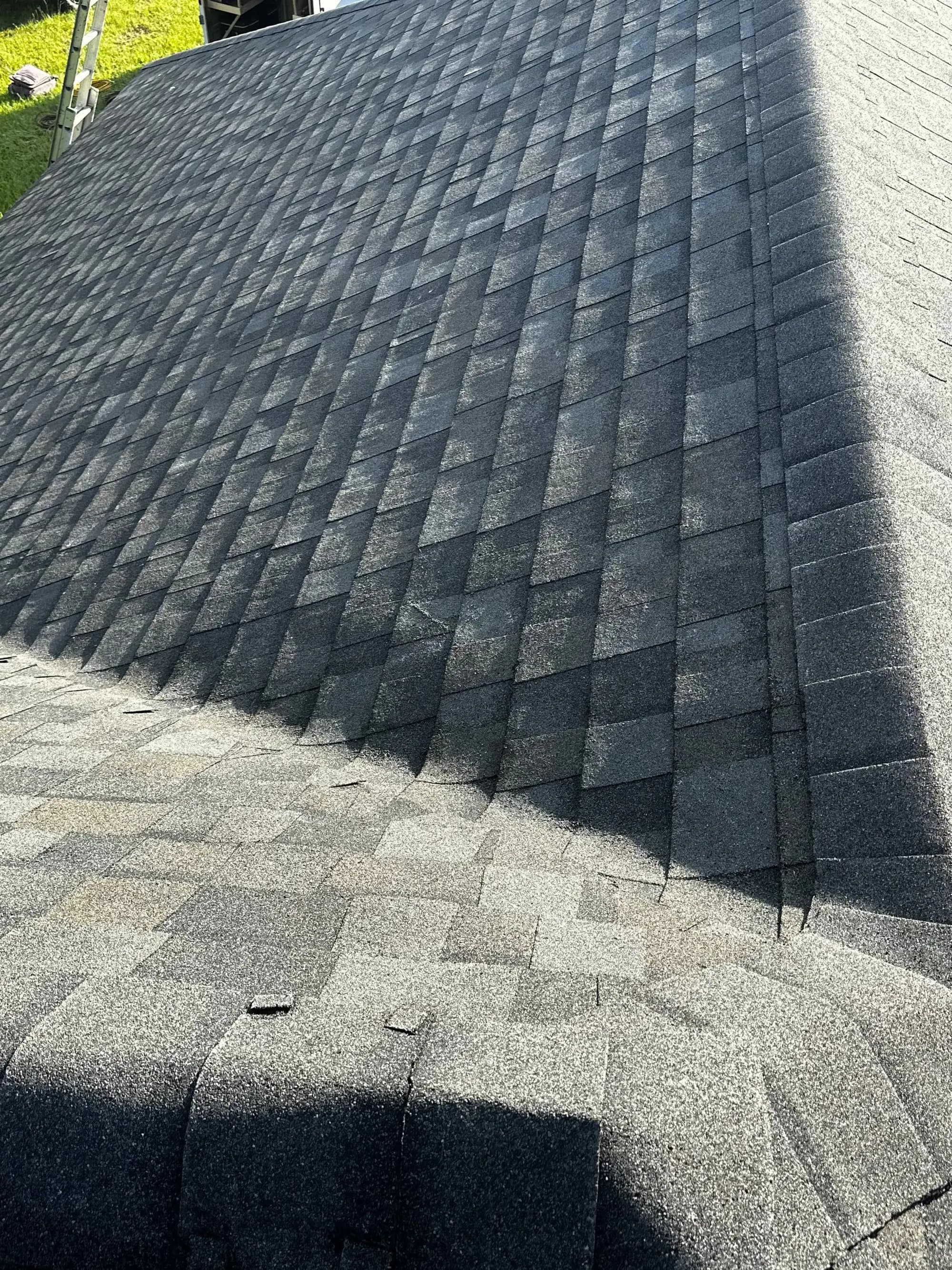 Hip and ridge detail on a newly installed architectural shingle roof